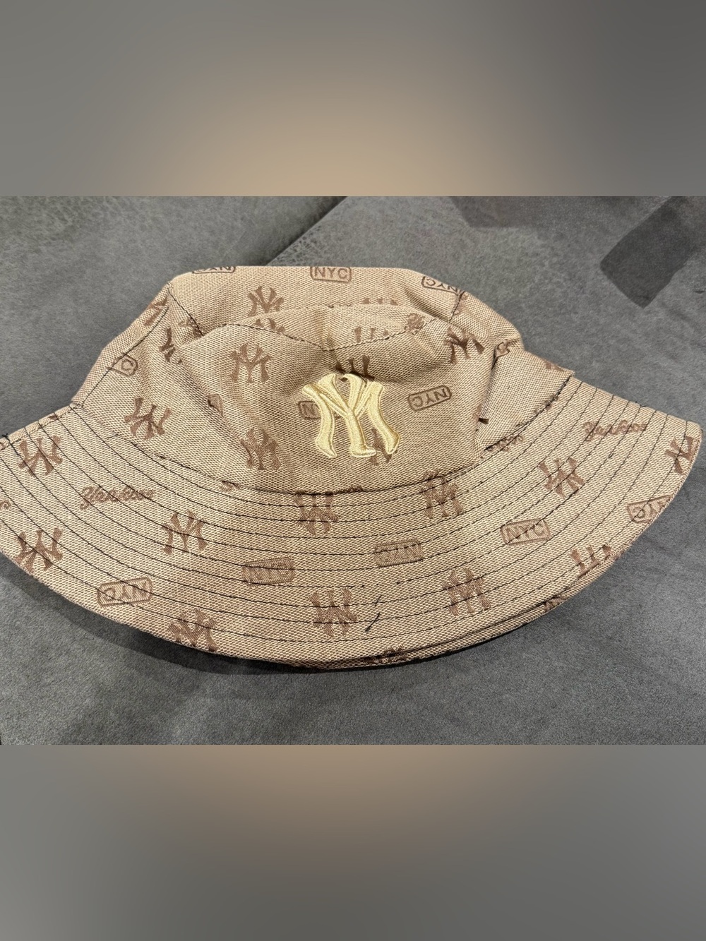 NY Yankees Beige Monogram Bucket Hat with Gold Emblem